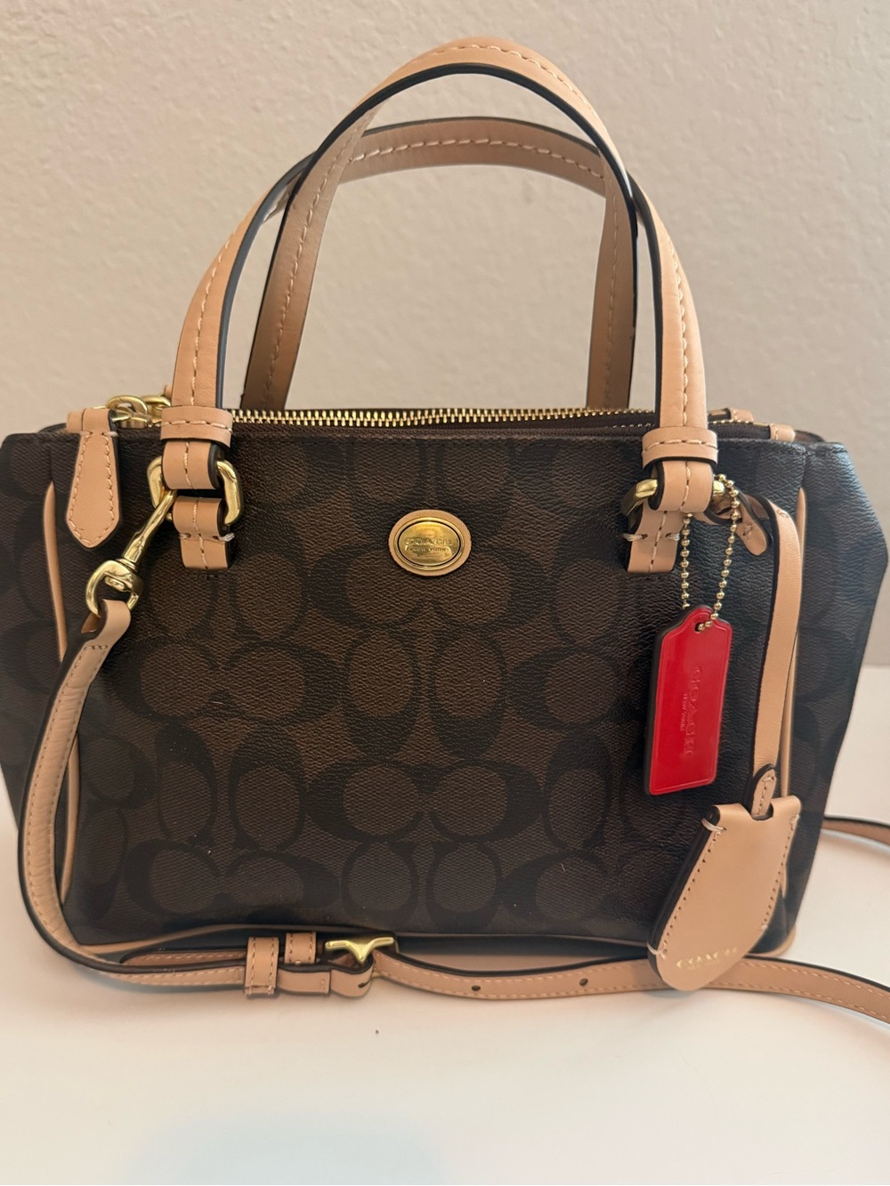 COACH brown and tan signature canvas satchel